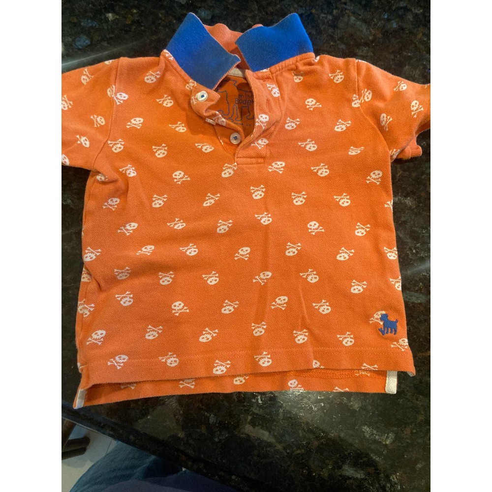 Orange Mini Boden Polo shirt with skulls & blue collar (3-4T)